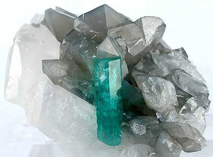 Emerald the May birthstone flanked by crystallized calcite